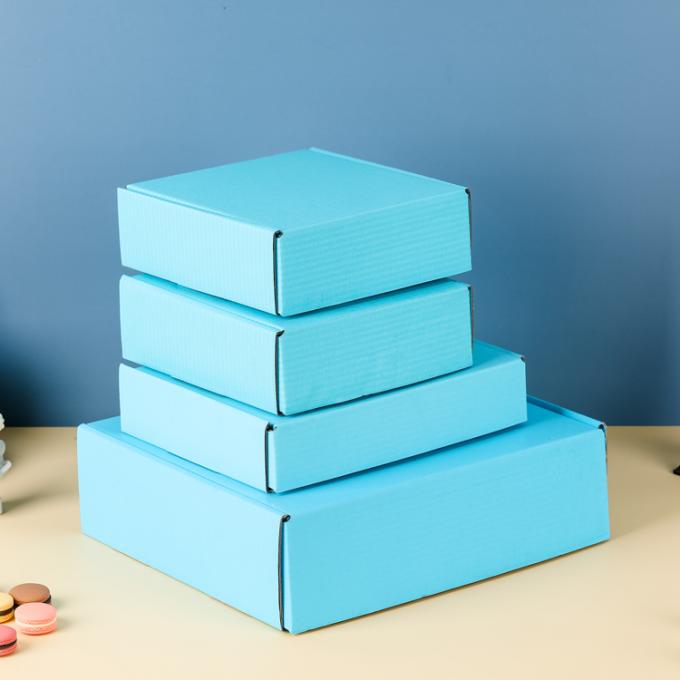 Logotipo impreso a medida Papel de cartón grueso azul plegable Cajas de envío para ropa zapatos 9